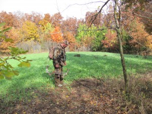 2013 Archery hunter Ryan Hyer checking out a mock scrape made on the interior plot "Cage Fight".  